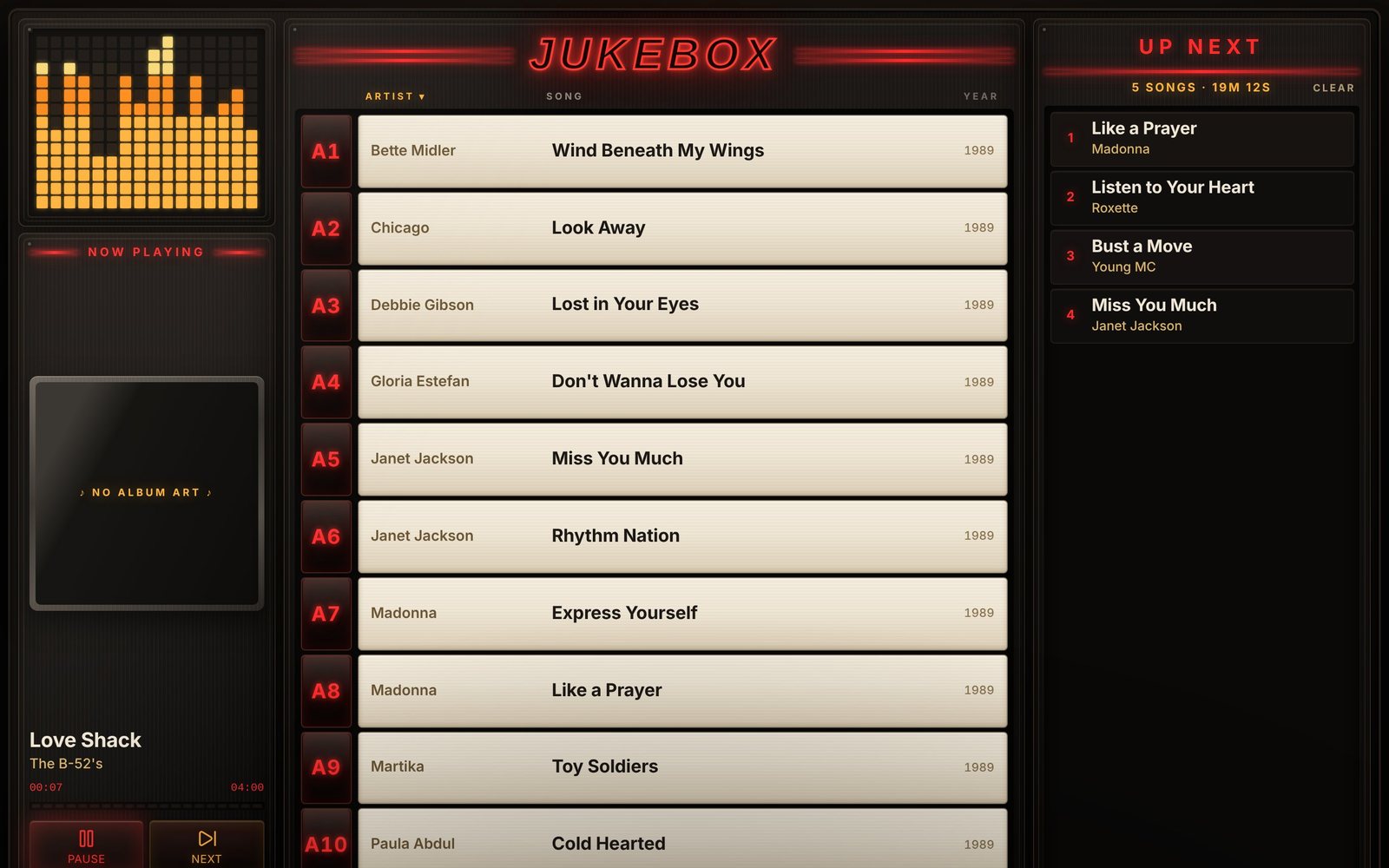 The jukebox on an iPad playing Heaven by Warrant, with cream title cards, red selection codes and a queue of power ballads